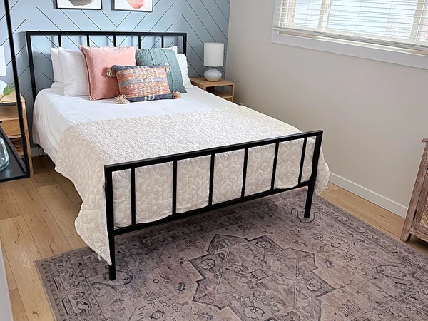 Bedroom reset with bedding, floors, and surfaces cleaned