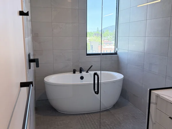 Bathroom tub, tile, and glass cleaned for a finished reset