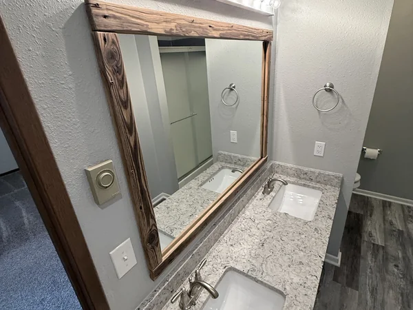 Bathroom vanity, mirror, and floor cleaned