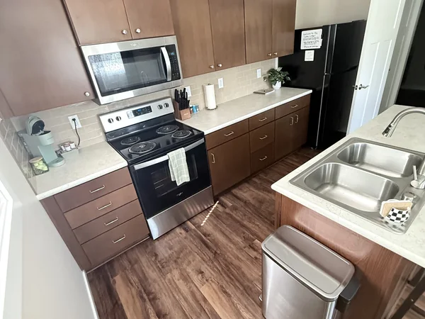 Compact kitchen sink, counters, and floor cleaned